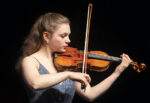 Young woman plays violin during the Young Texas Artists 2022 Finalists" Concert & Finals
